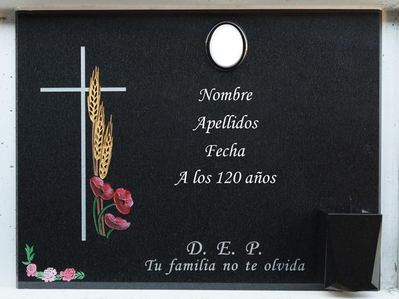 Lápida con cruz, espigas y amapolas grabadas
